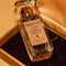 up close of grand cuvee eau de toilette bottle and box in a gold box