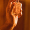 model spraying grand cuvee eau de toilette bottle and box