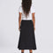 back view of model wearing flowy black midi skirt
