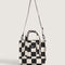 black and white checkered small tote bag with white adjustable strap