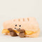 side view of smiley grilled cheese warmies heating plush