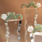 three white orange blossom squiggle hair claw in clear pedestals