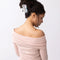 model wearing white Persian cat hair claw with pink bow on their neck