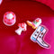 pink trinket tray with white and blue boot with star details with de-stress balls
