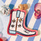 pink trinket tray with white and blue boot with star details in blue and white stripe table