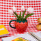 12 oz. strawberry ceramic mug with 3D snail on the handle with flowers inside