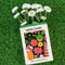 ceramic vase in the shape of wildflowers seed packet with flowers inside