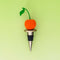 metal wine stopper with red cherry topper