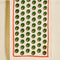 cream tea towel with all over olive print and red border