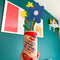 model holding lucky cherry cream soda with cardboard flowers inside