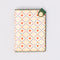 Vegan leather passport holder with cherry hearts print, dark green strap and brass snap, 8 by 5.5 inches.