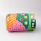 rolled quilted blanket with colorful ill and house print with 'house has my favorite places and faces' typography in the center