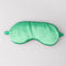 green gingham back of colorful patchwork eye mask with cream 'shhhh...can't you hear i'm snoring?' across the front