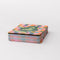 colorful checkered card case with green tree air fresher graphic that says 'on the road again! PLEASANTVILLE USA' stacked