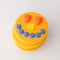 Smiling pancake de stress ball with cute face design