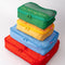 Side view of set of 4 packing cubes with various sayings and realistic prints