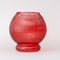 front view of textured apple shaped pitcher with green handle