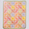 colorful patchwork print quilted blanket  with light green trim
