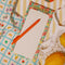 Magnetic shopping list notepad with colorful fruit illustration