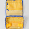 interior yellow gingham of blue and white Scandinavian plaid with red bow handle