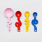set of 4 stainless steel measuring spoons in pink, red, yellow and blue with squiggle handle