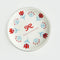 white ring tray with red and blue pixelated have a nice day and red flowers