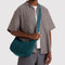 model carrying deep sea medium crescent bag