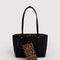 reversed side of reversible leopard tote with black interior