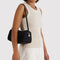 model carrying black nylon loaf bag