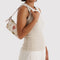 model carrying cream pochette with abstract floral