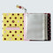 inside of mini photo album with yellow with black polka dots and maroon with pink dots