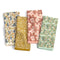 set of 4 dainty floral tea towels: white wildflower, goldenrod floral, pink floral, and sea foam strawberry print