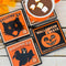 set of 4 orange vintage halloween coasters: witch, pumpkin, ghost and black cat with of cocoa on the witch coaster