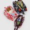 set of three 3D zip set: small plum western cut-outs, medium cream and red cowgirl, and large black and colorful horse cut-out print with items inside