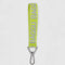 lime green keychain with grey 'baggu' logo and carabiner clip