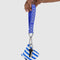 model holding royal blue logo keychain with light blue 'baggu' print