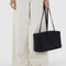 model holding medium nylon black bowler bag