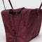 side view of mahogany rectangular bowler bag with bag charm clip