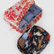 set of 2 packing cubes small navy with colorful horse cut out print and large white with red cowgirl print with items inside