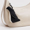 penguin bag charm on cream bag