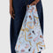 model holding light blue standard baggu with hair notions, makeup and bow print