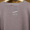 backview of rosewood sweatshirt with white Bonjour De La Bibliothèque across the front