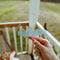 model holding cornflower 'pyrex' inspired suncatcher sticker