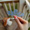 model holding cornflower 'pyrex' inspired suncatcher sticker
