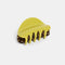 double sided hair claw: translucent brown with black dashes and lime green/yellow reverse side
