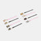 scattered black and pink bobby pins and tin with dangling kitty charm