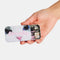model holding black and pink bobby pins and tin with dangling kitty charms