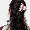 model wearing light pink small octopus hair claw