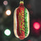 shiny hot dog ornament with glitter 'MERRY' written in mustard