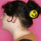 model wearing birdie wood collab yellow smiley hair claw